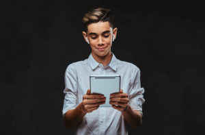 Young student using tablet.