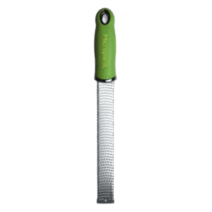 Green Microplane kitchen tool.
